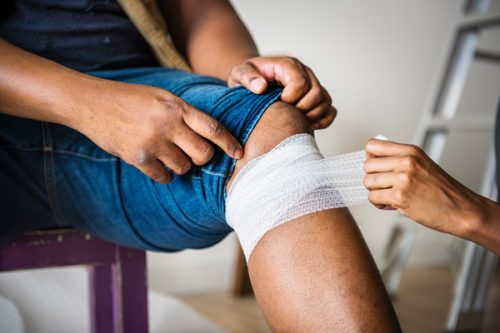 first aid on man's knee