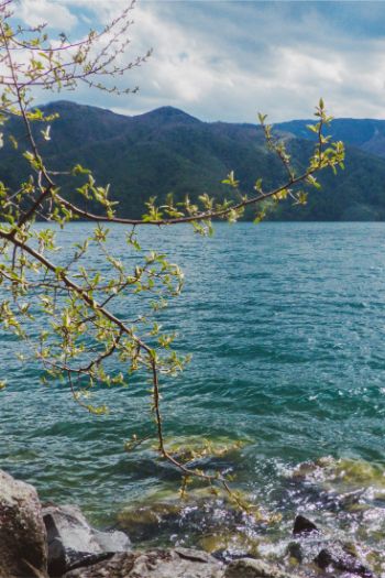 blue Chuzenji Lake in Nikko, Japan, on a sunny but windy day