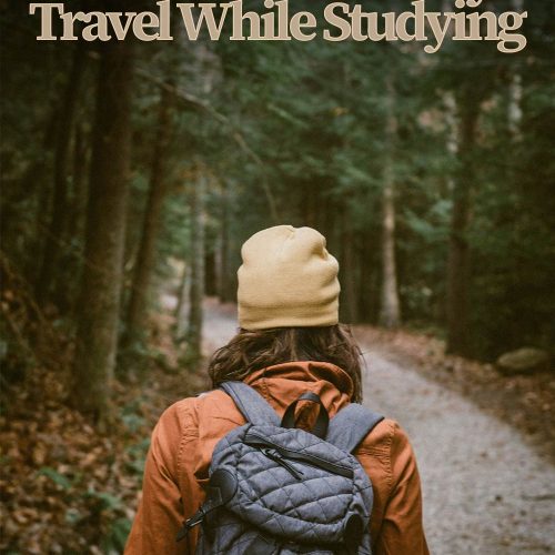 woman in orange jacket and yellow beanie seen from the back walking into pine forest