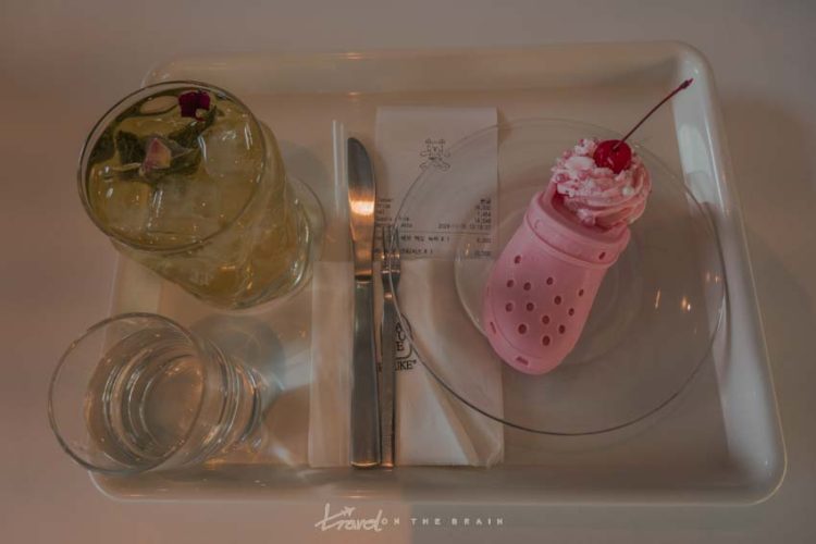 pink croc-shaped cake with iced lemonade