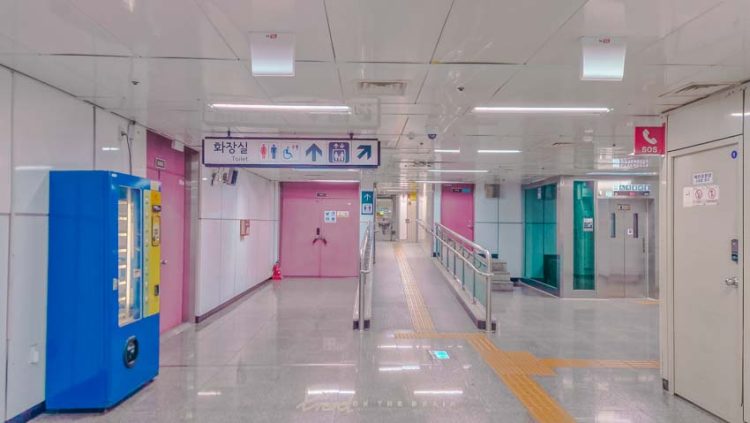 corridor leading to public bathrooms in metro