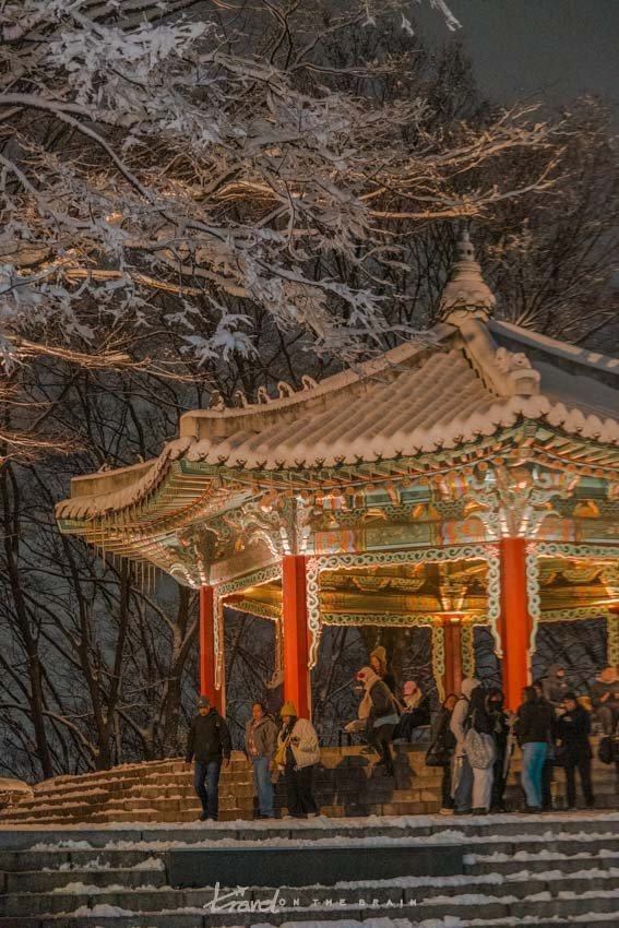 lit up pavilion in Seoul during winter snow