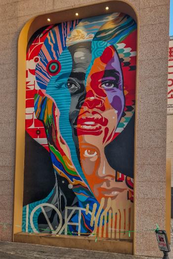 colourful mural showing faces overlapping