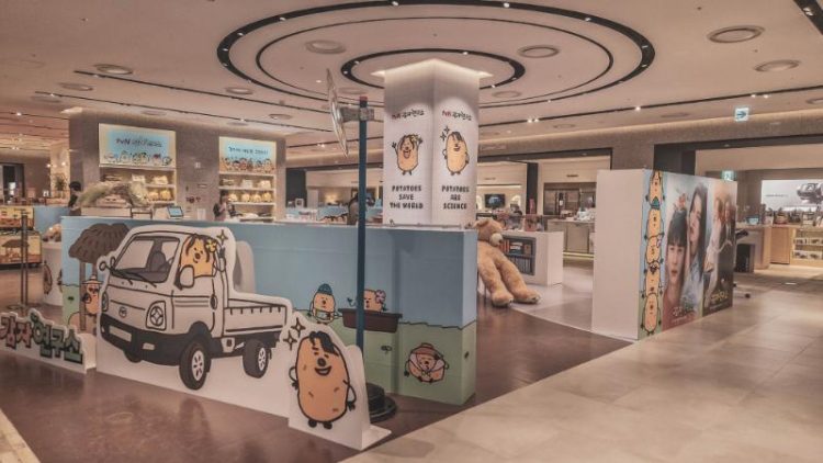 open plan store with cute potato comic cutouts