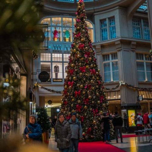 giant Christmas tree inside a historic shopping arcade